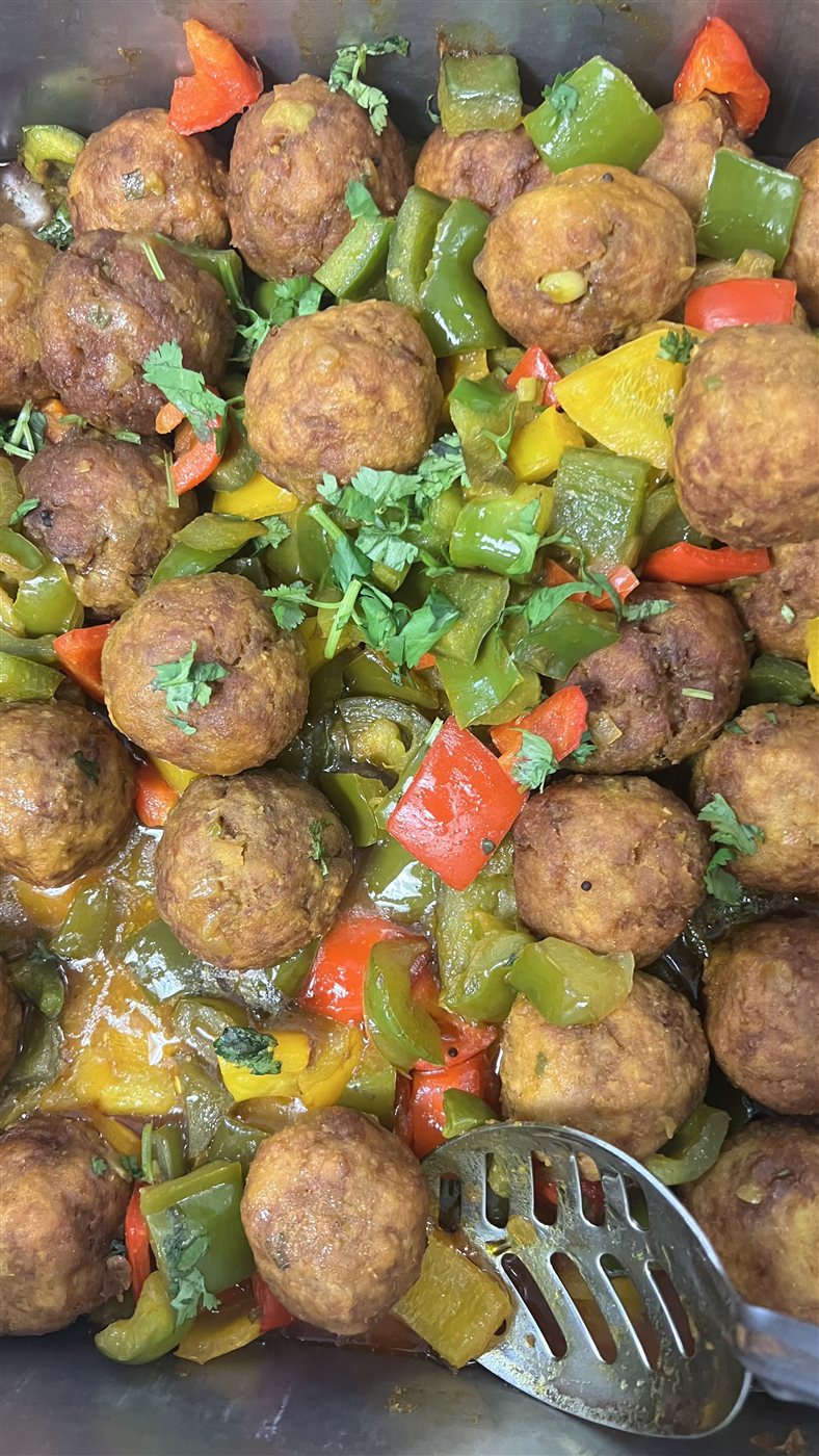 Golden bites with colorful peppers and vegetables from the kitchen