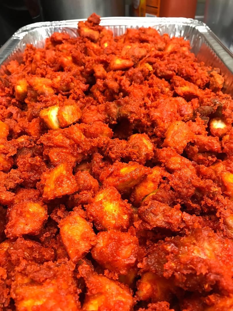 A tray of richly spiced food from the kitchen